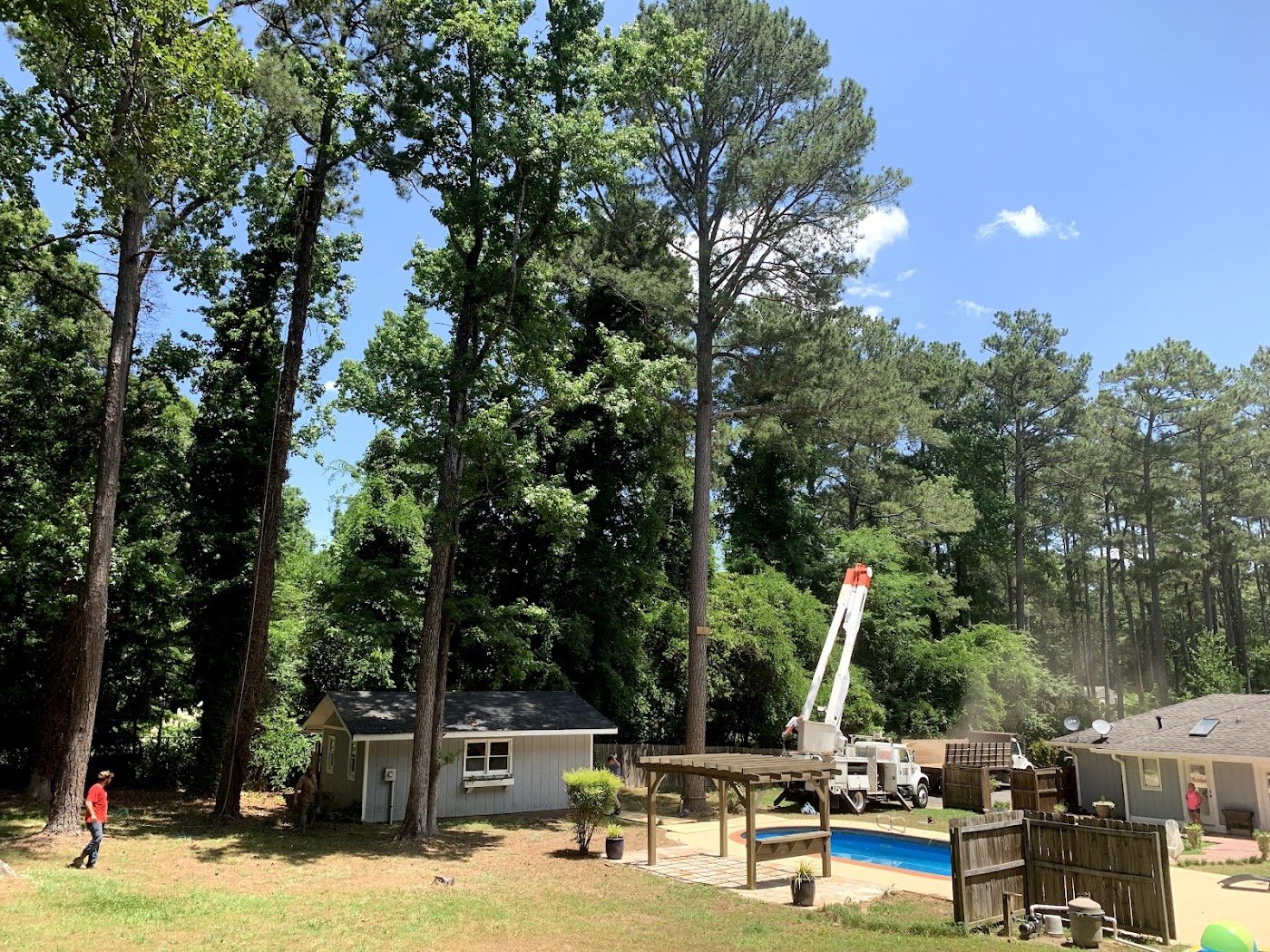 Bucket truck trimming at a home